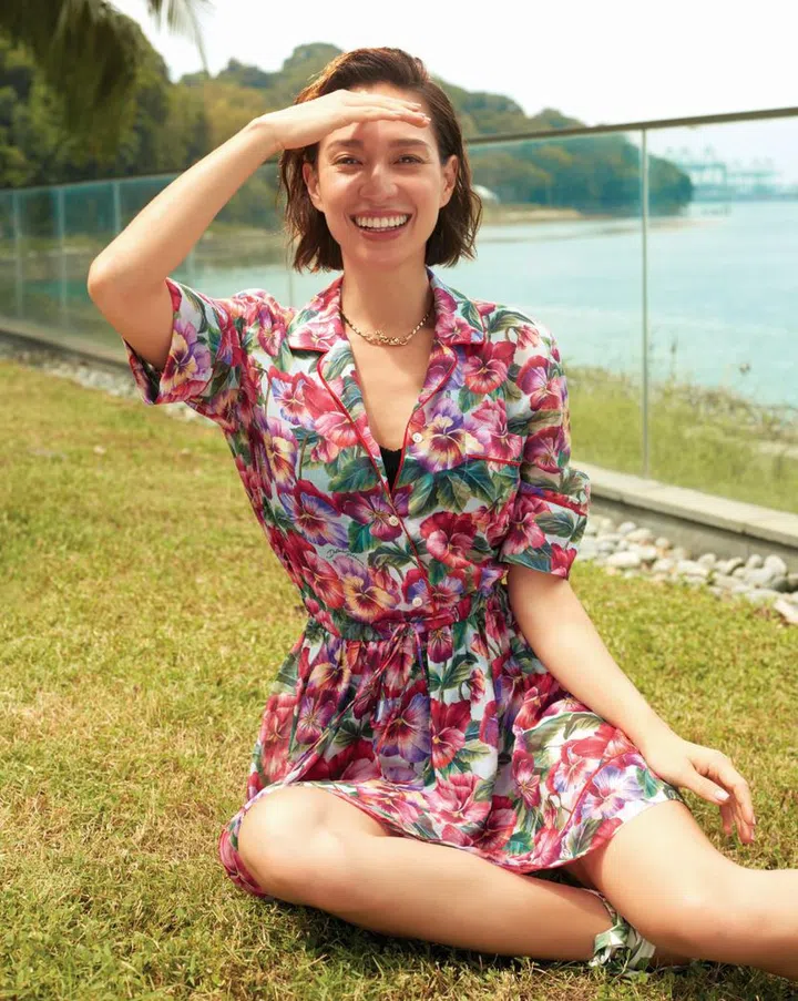 Floral lace body suit and heels, all Dolce & Gabbana; Panthère de Cartier necklace from Cartier.  