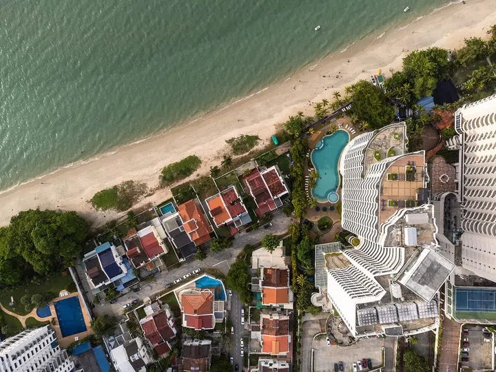 Top down view of the Batu Ferringhi residential district and beach near Georgetown in Penang in Malaysia