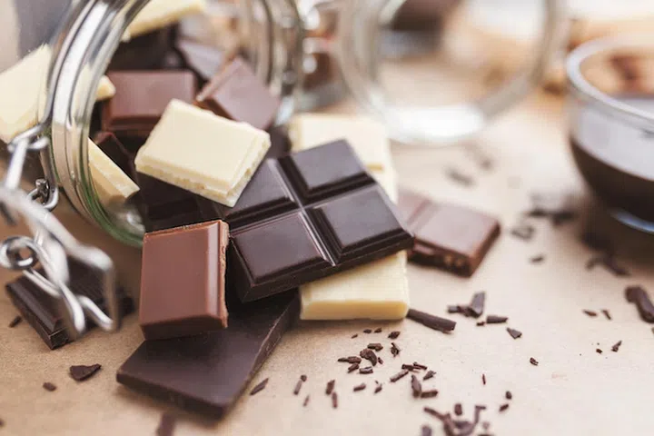 Variety of delicious chocolate bars in a jar