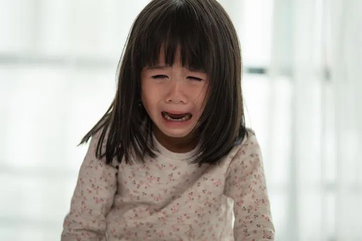 Portrait of Asian little girl sad and crying