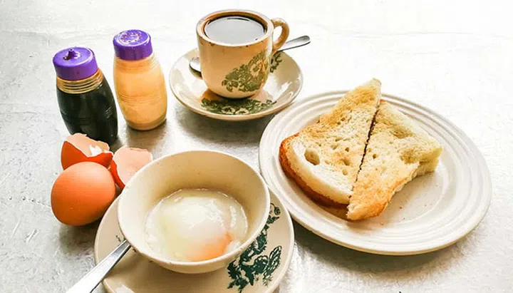 typical singapore coffee shop breakfast kaya toast coffee soft-boiled eggs
