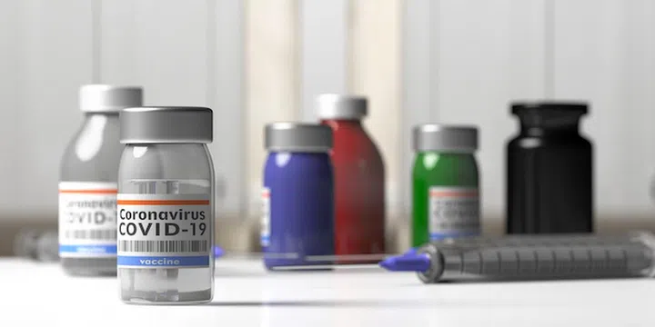 Coronavirus Covid 19 Vaccine. Medical injection syringe and vials with vaccine medicine. Health care vaccination, medication concept. 3d illustration