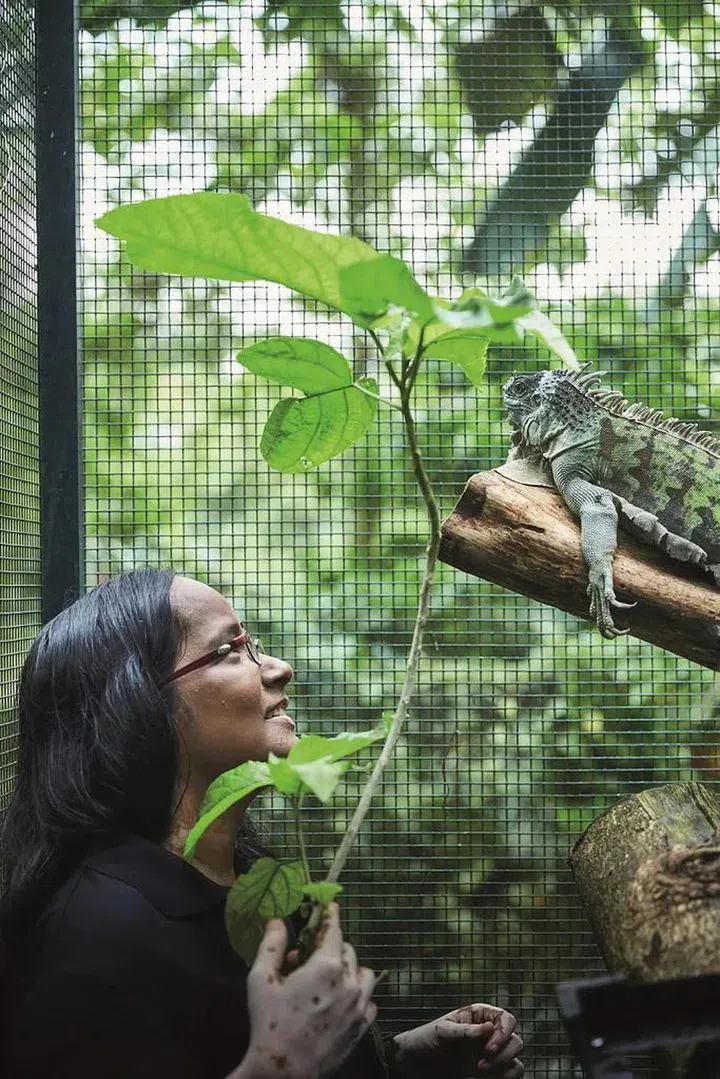 Acres co-CEO Anbarasi Boopal with an iguana. Photo: Lawrence Teo