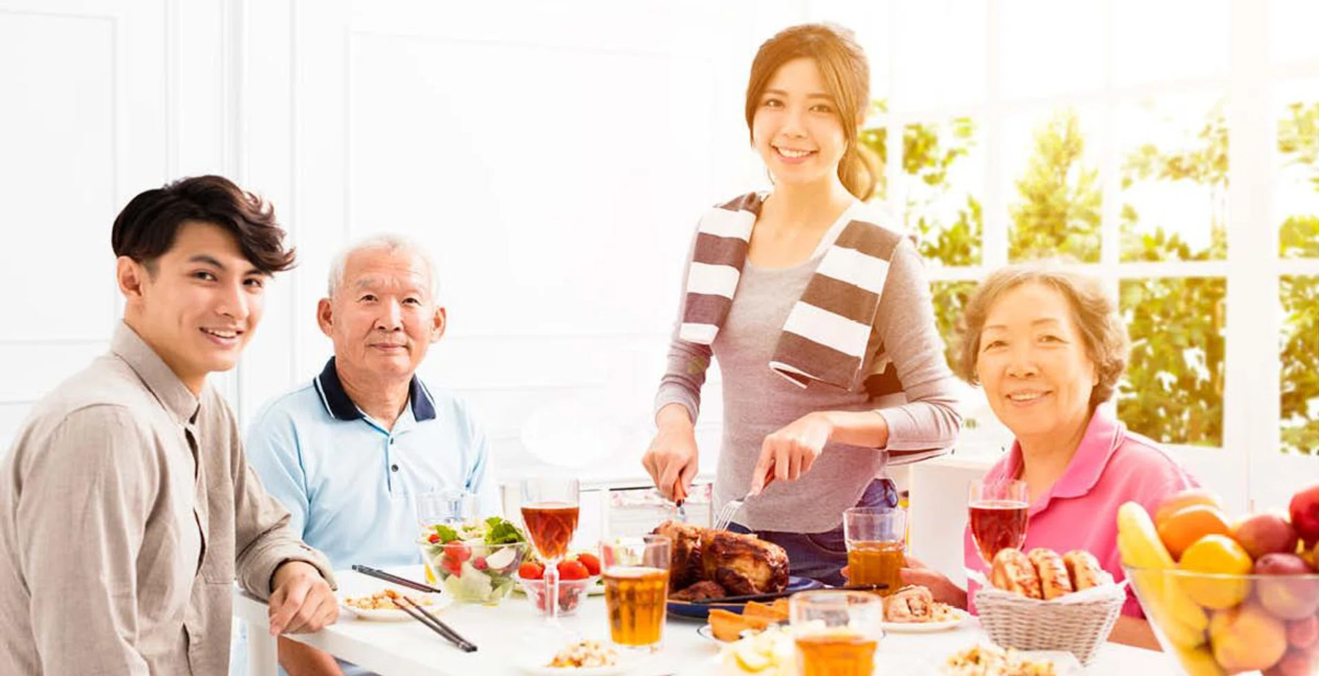 An Asian family having a meal in the day for Father's Day