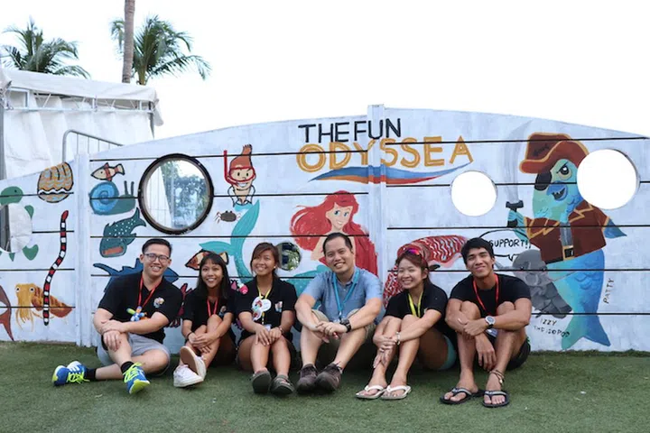Co-founders of Our Singapore Reefs Sam Shu Qin and Dr Toh Tai Chong (third and fourth from left) at one of their outdoor exhibitions.