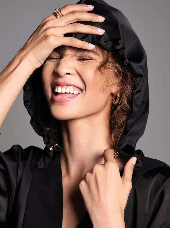 Nylon hoodie dress, Prada Clash de Cartier pink gold small hoop earrings, Panthere de Cartier pink gold, tsavorite garnets and onyx ring, Juste un Clou yellow gold small ring, and Juste un Clou white gold small ring