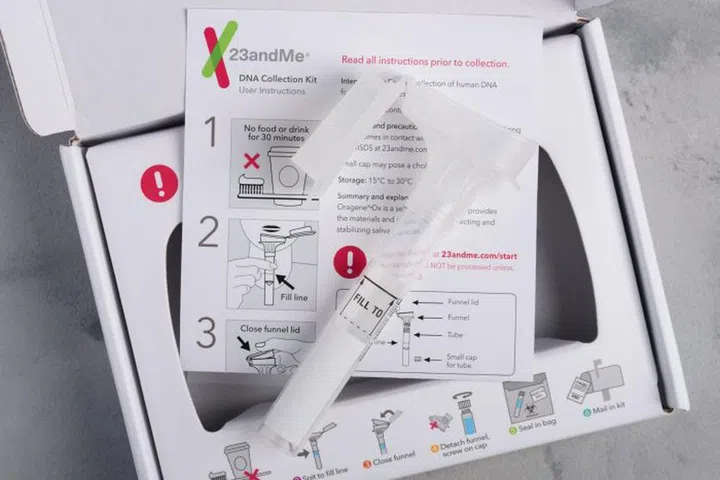 Kiev, Ukraine - 17 October 2018: 23andMe personal ancestry genetic test saliva collection kit, with tube, box and instructions. Illustrative editorial.