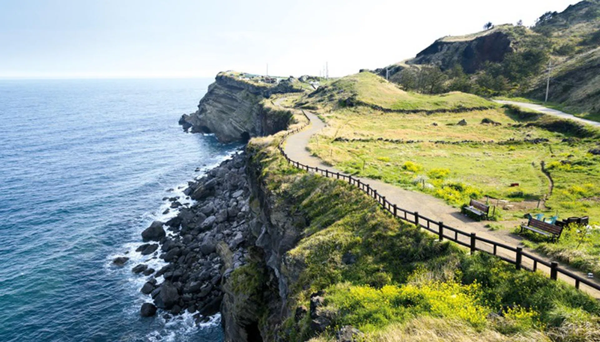 View of Olle walking path No. 10 Course in Songaksan in jeju island, Korea. Olle is famous trekking courses created along coast of Jeju Island. Songaksan is famous place for drama "All-in" filming location.