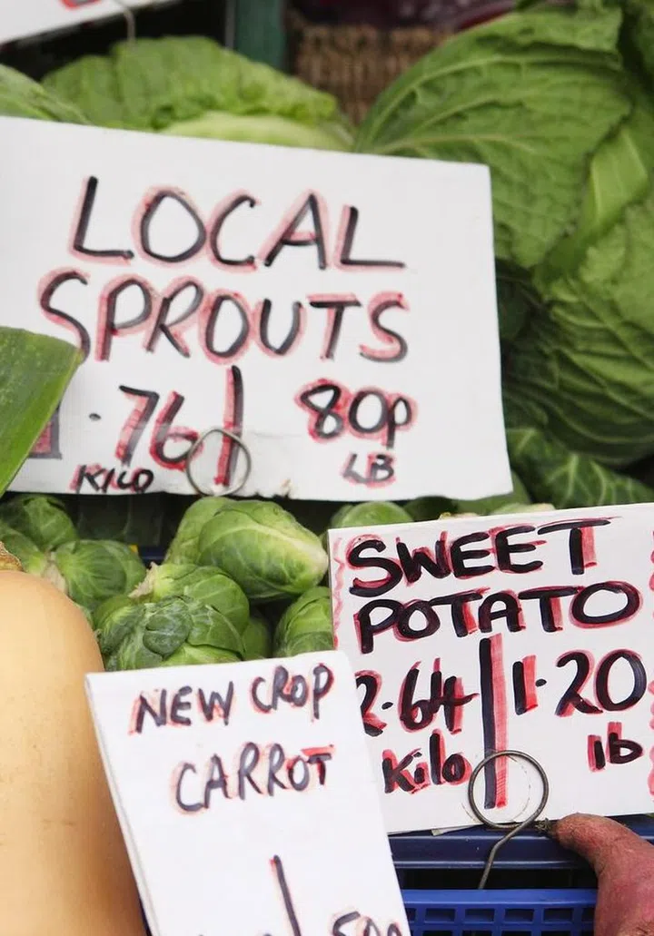 8473785 - a display of fresh english vegetable produce on a market stall in great yarmouth, norfolk, england