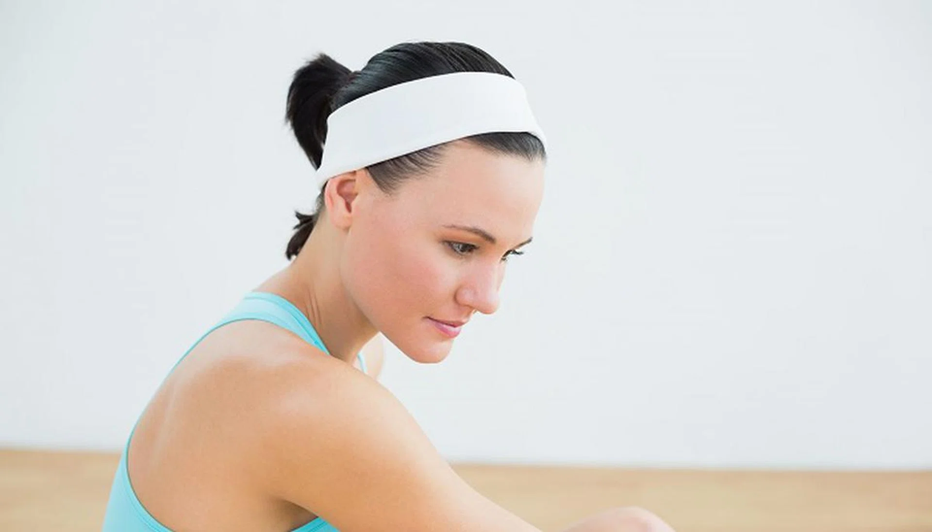 25434751 - close-up side view of a thoughtful toned woman in fitness studio