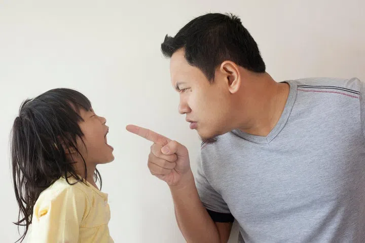 Young Asian father and little baby girl daughter arguing, screaming each other, dad mad at his kid