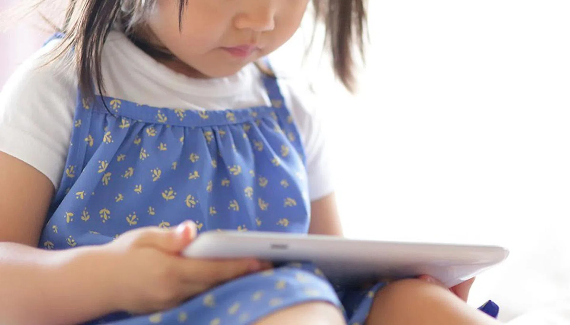 45721156 - child girl happy play game with tablet pc. asian child