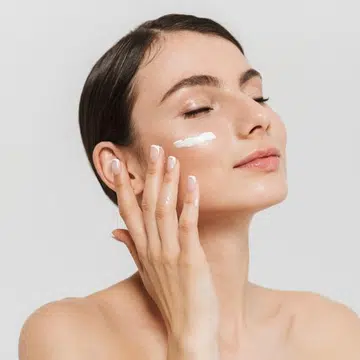 woman applying skincare