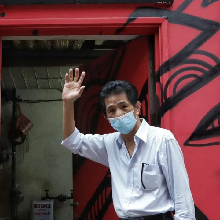 ST20211005_202149797859/kgtan/Kevin Lim/Keng Gene/One of the last times owner Tan Boon Chai, 71, and his wife Yeo Ah Suei, 68, are coming down to open the shop, their morning routine, and preparing for the queue at 11am where customers come and buy their popular beh teh soh (or Chinese Horseshoe biscuits). Oct 5, 2021.
