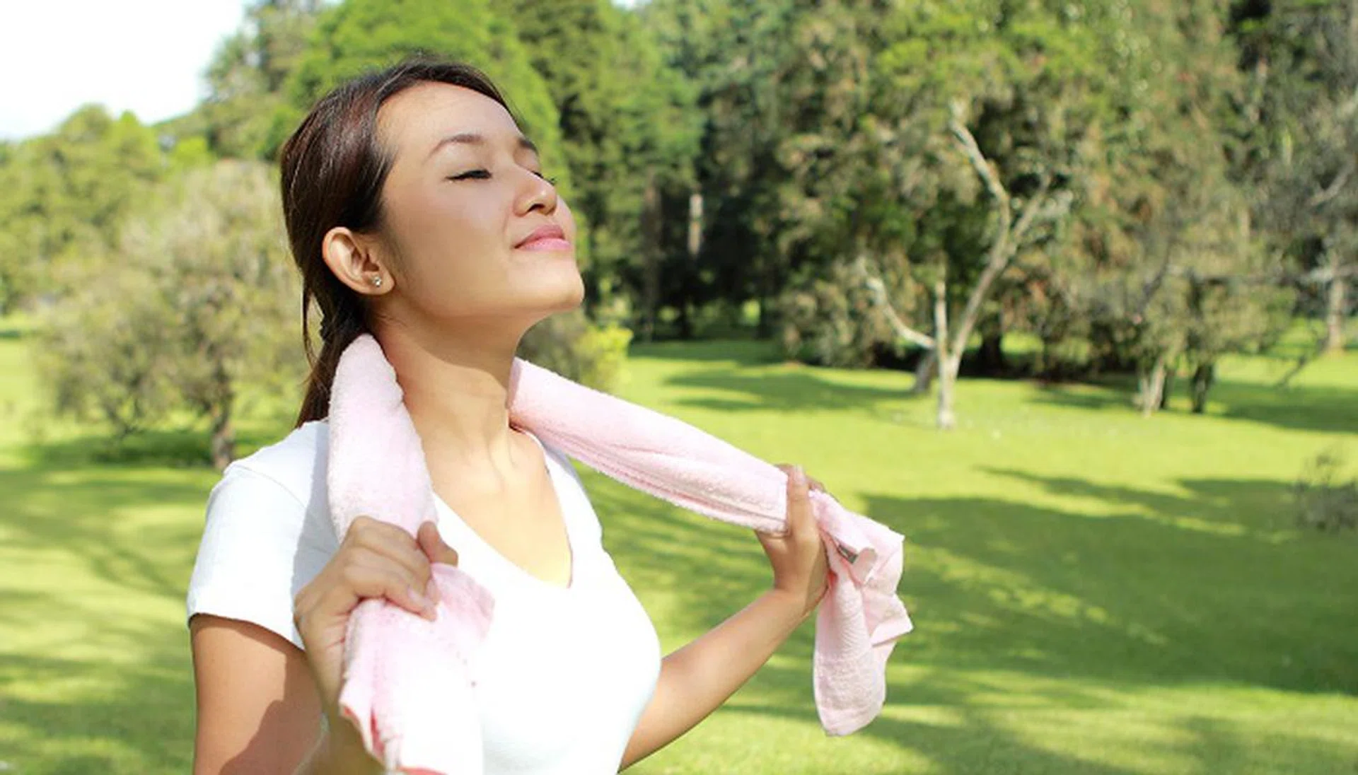 39402715 - portrait of sporty woman feel relax and happy under the sunshine at park with fresh air