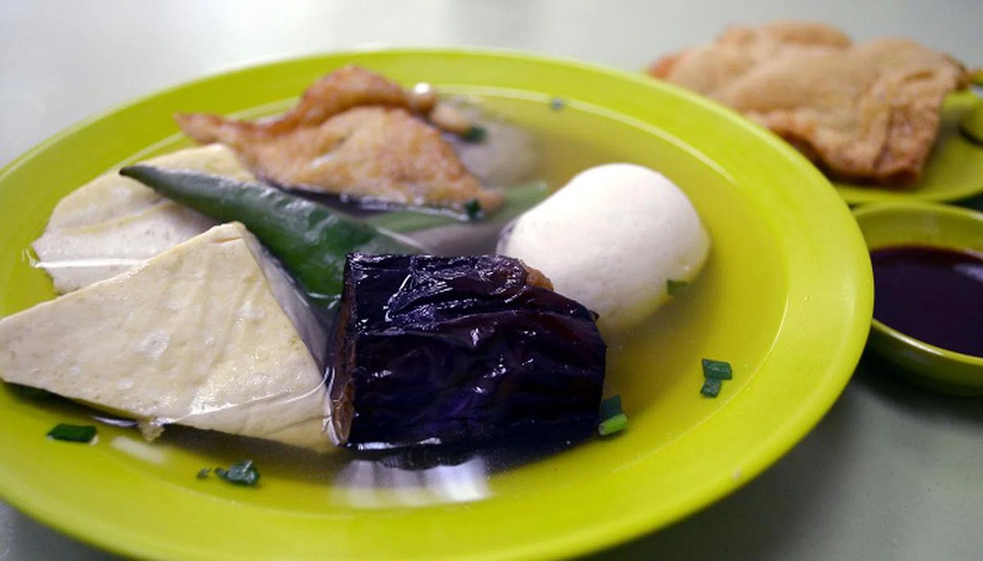 Yong Tau Foo (or Niang Dou Fu) is a local dish made from soy beans.  It is a traditional dish of the Khek or Hakka dialect group.  It is sold and eaten by Chinese communities throughout the world.  This picture is taken at Katong, a popular foodie enclave in Singapore 