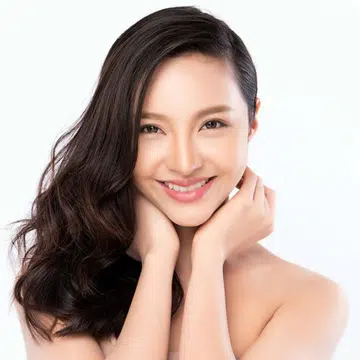 pretty asian woman with flowing hair over one shoulder