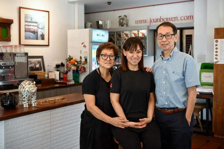 Mr Khong Yoon Kay (right) and Mrs Jeanne Seah-Khong (left) set up Joan Bowen Cafe for their daughter Joan (centre) so that she could have meaningful employment and social engagement. ST PHOTO: KUA CHEE SIONG