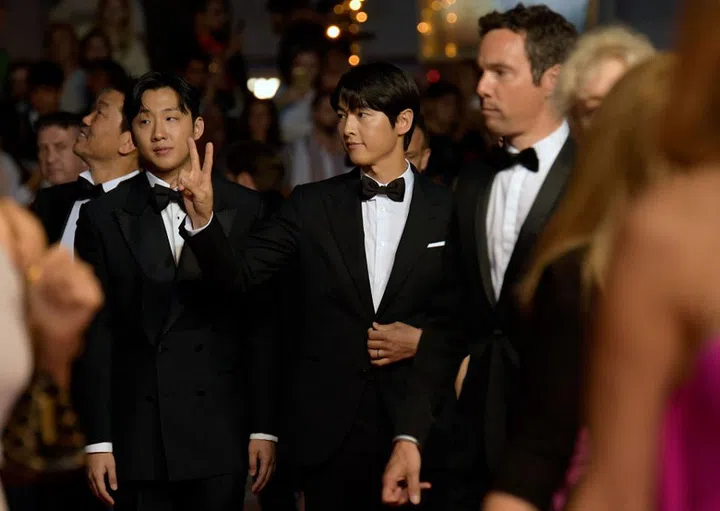 CANNES, FRANCE - MAY 24: Xa Bin Hong and Joong Ki Song attend the "Il Sol Dell'Avvenire (A Brighter Tomorrow)" red carpet during the 76th annual Cannes film festival at Palais des Festivals on May 24, 2023 in Cannes, France. (Photo by Kristy Sparow/Getty Images)