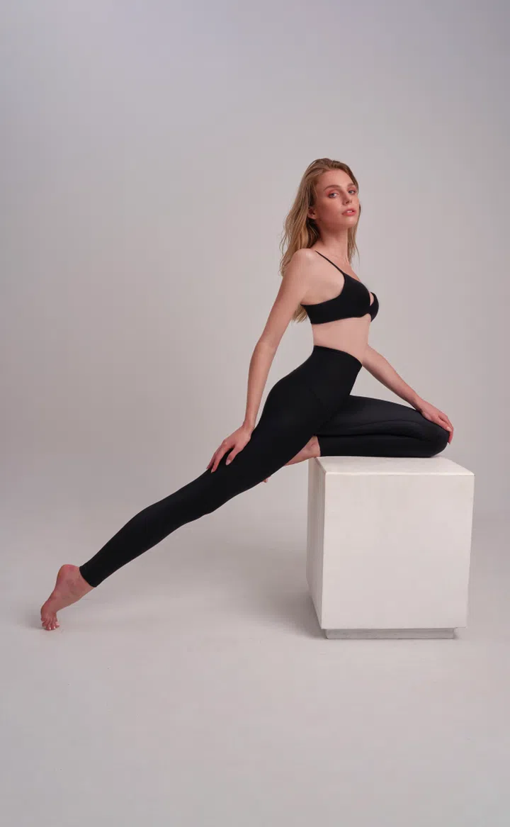 The Slim, the ultimate shaper pants, offers a flattering fit with lightweight yet powerful support. Featuring a high-waist design and a fully-bonded front panel, it flattens the waist and trims the tummy while steel bones in the side panels refine the silhouette. Credit: Lazywaist