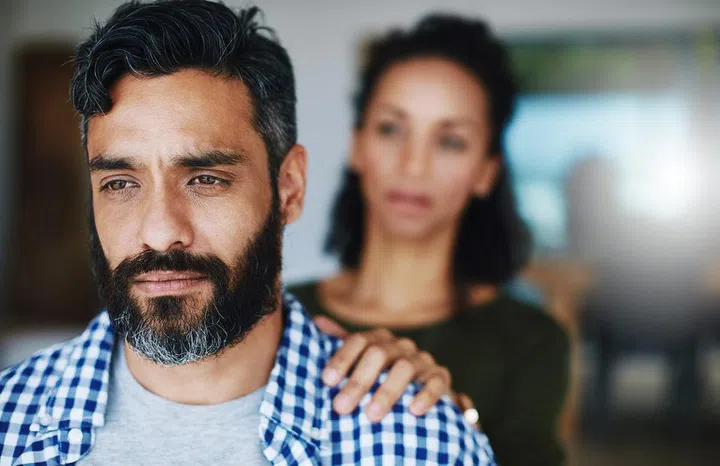 Dont keep it all bottled up. a woman comforting her distraught husband at home