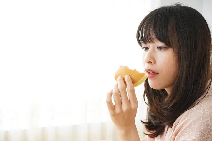 Young woman having a breakfast