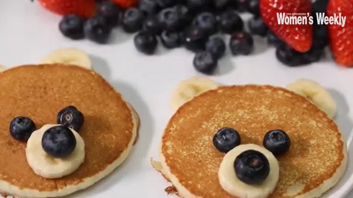 02. Choose blueberries of the same size for the eyes, and one for the nose. Garnish the plate with berries, or fruits of your choice and serve with berry compote.