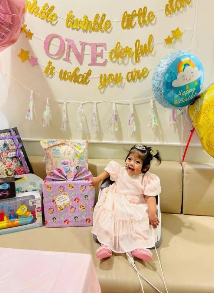 Nur Faathimah Assyifa’ celebrating her first birthday in the NUH ward in July 2021. PHOTO: COURTESY OF NUR SYAHIDAH WATIB