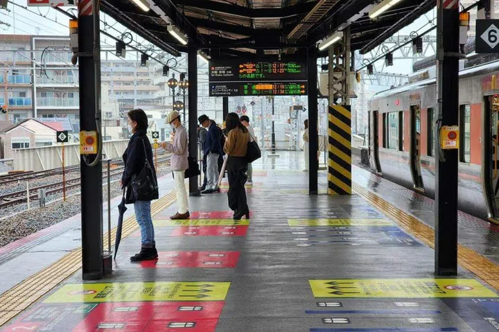 Commuters waiting for the train at a train station in Japan. ST PHOTO: VERA ANG