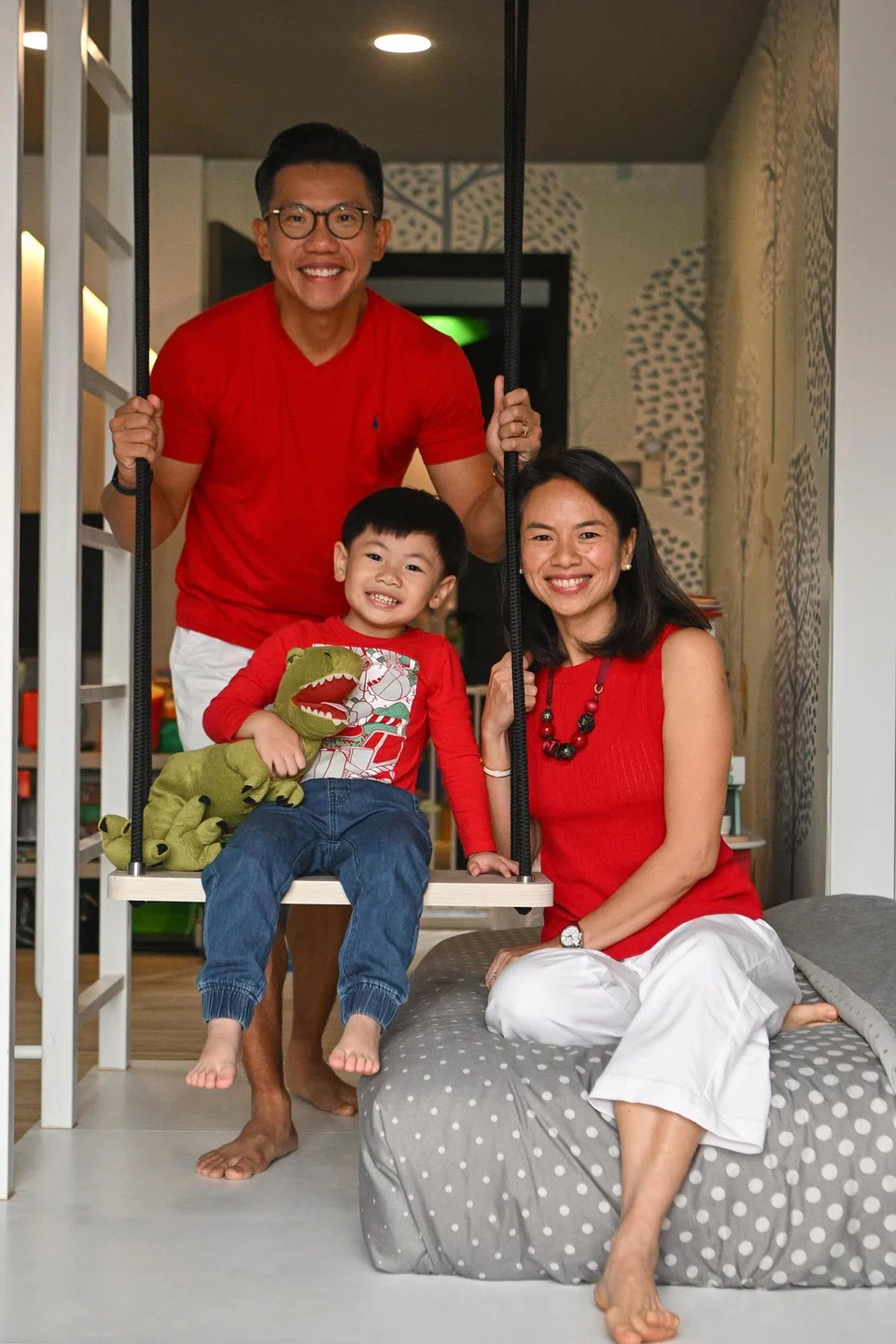Ashton with his parents Mr Richard Leow and Ms Claire Teo. ST PHOTO: LIM YAOHUI