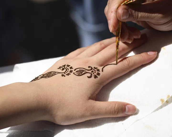 Applying henna to create a temporary and painless tattoo is an ancient tradtion in the Middle East, North Africa, and on the Indian subcontinent. Indian brides often have their hands and feet decorated in this fashion. This is known as henna, Mehndi and Mehendi in various parts of the world.