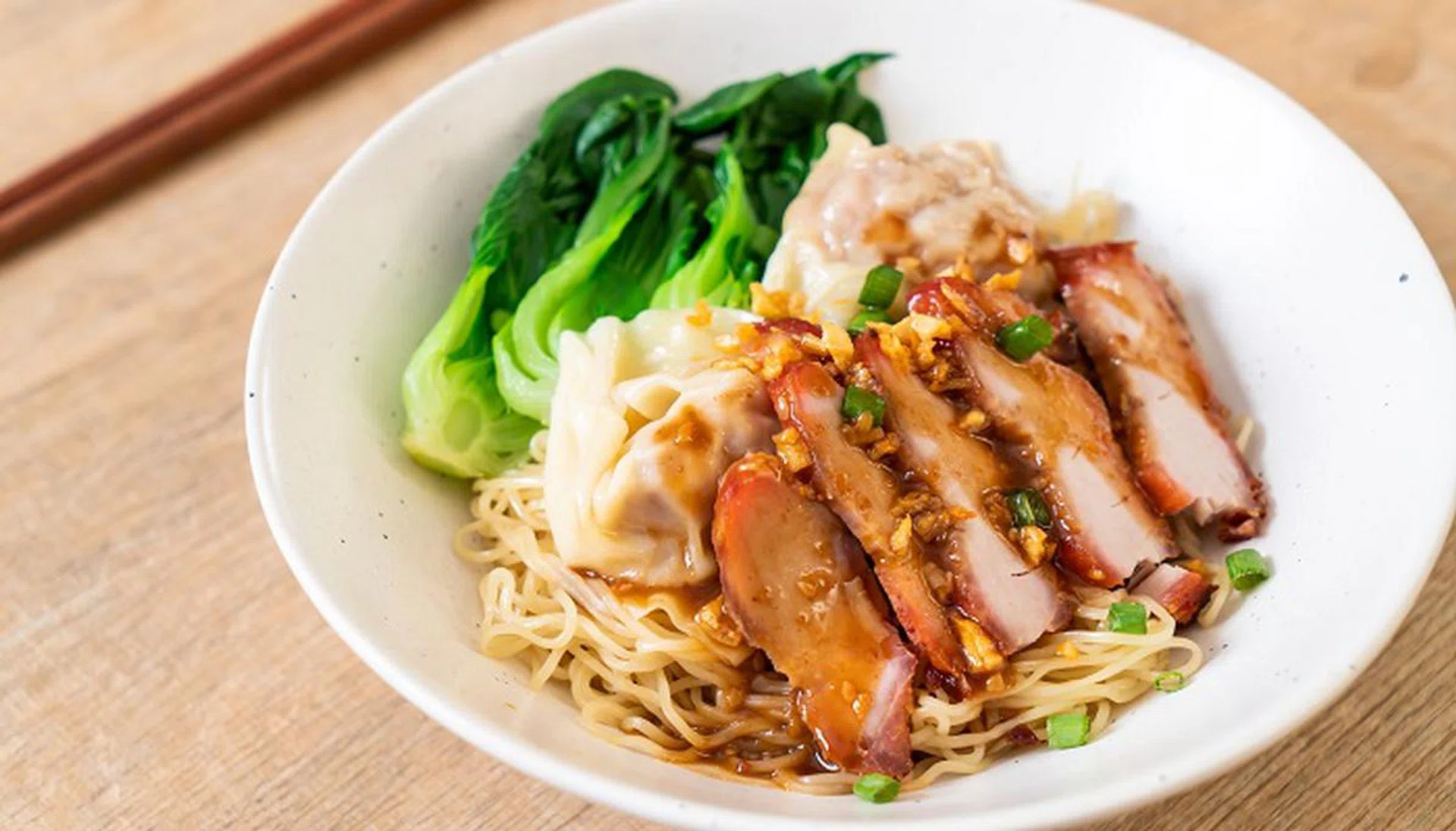 egg noodle with red roasted pork and wonton - Asian food style