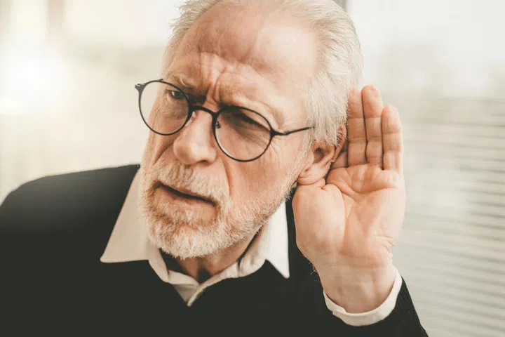 Portrait of senior man having hearing problems