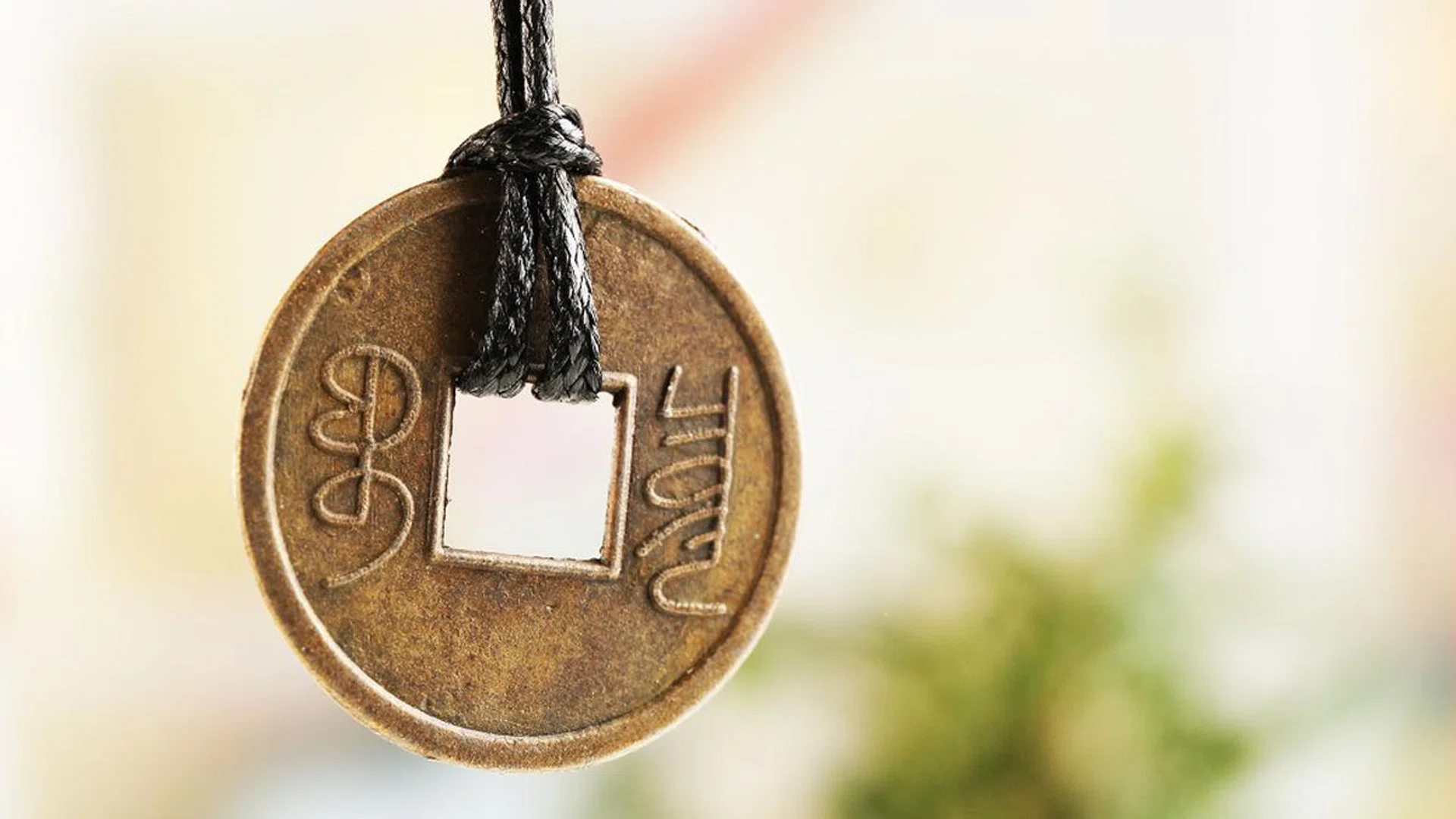 Feng shui coin on light background
