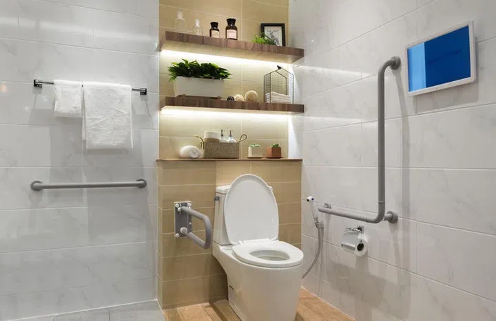 Interior of bathroom for the disabled or elderly people. Handrail for disabled and elderly people in the bathroom