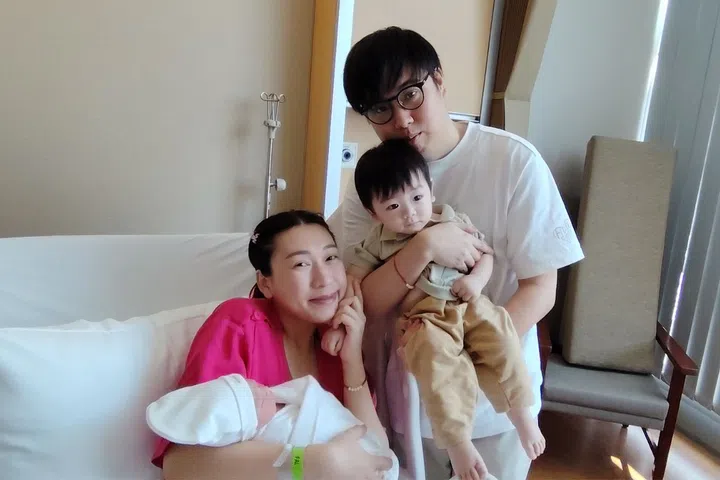 Emile Penpanassak and Lau Jin Hui, both 32, with their newborn Selene Lau Xing Yi and one-year-old son Skyler.