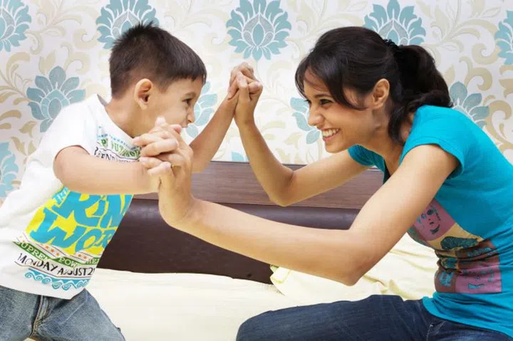 Mother and son having fun fight