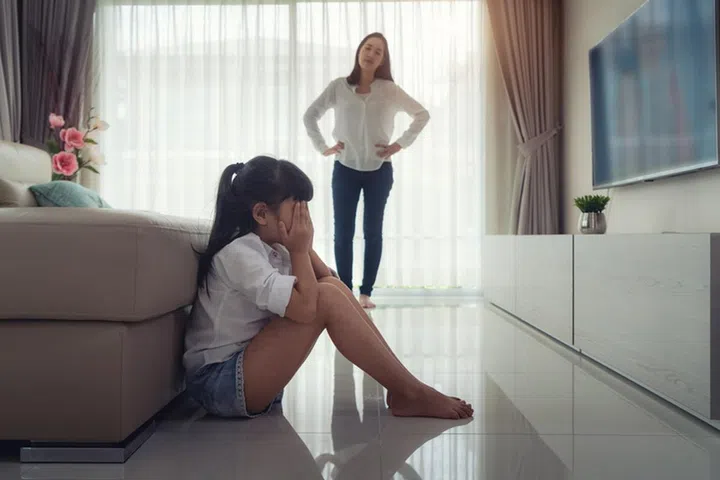 Asian mothers scold you for making a mistake. The children bent down, kneed and admitted their mistakes on the floor of the house.