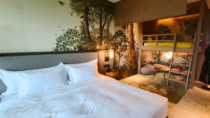 Parents get a spacious king-sized bed, while youngsters can imagine they're sleeping amidst the great outdoors. Credit: The Singapore Women's Weekly
