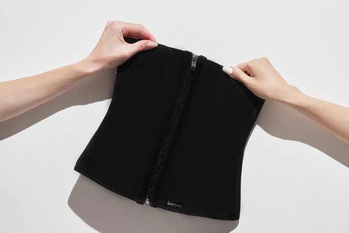 Waist training is a practice that involves wearing a tightly-laced corset or waist trainer for extended periods to cinch the midsection, helping the wearer work towards achieving a slimmer silhouette. Credit: Lazywaist