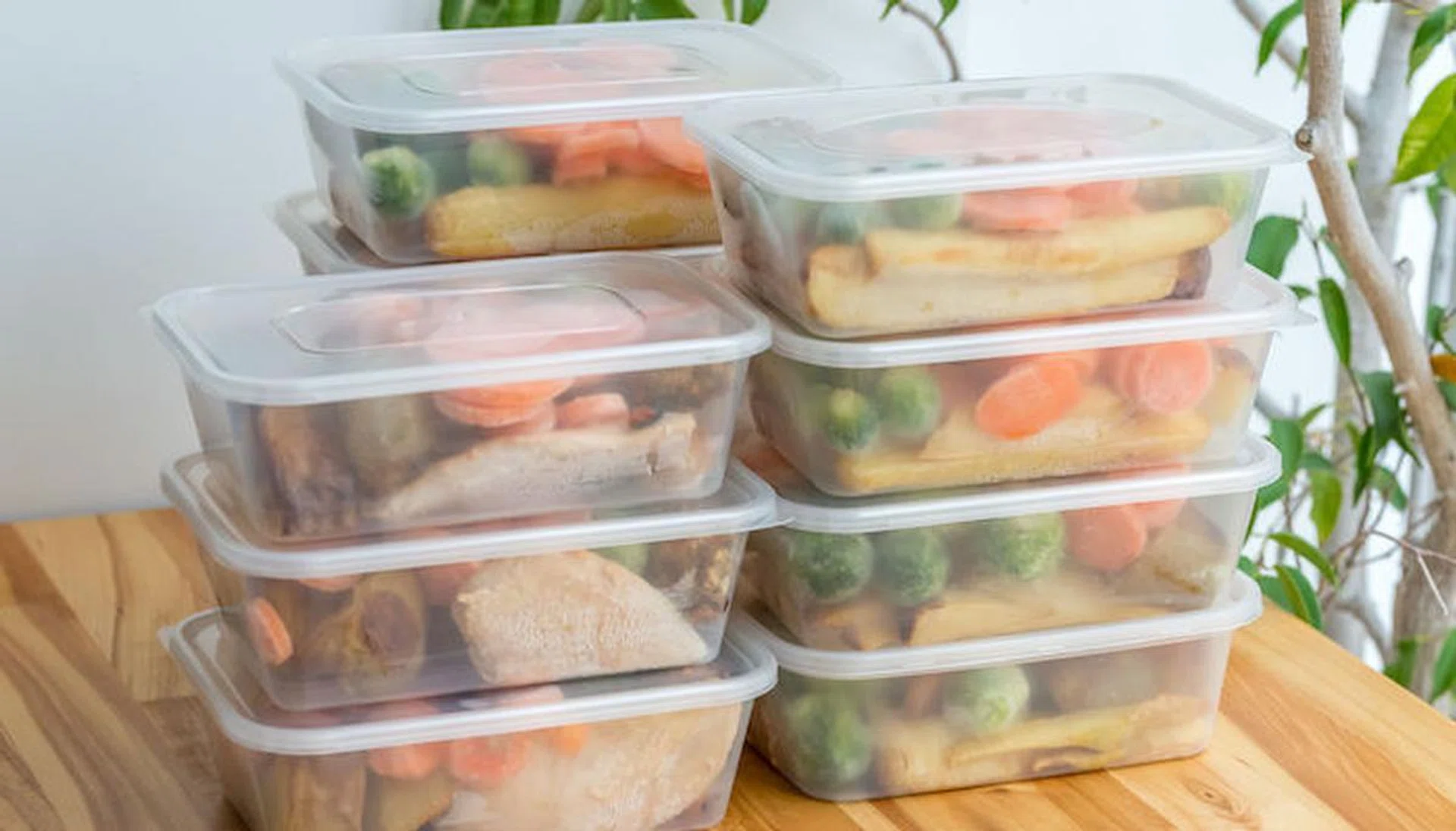 Meal prep. Stack of home cooked roast chicken dinners in containers ready to be frozen for later use. 