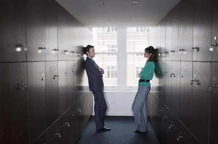 Business couple in locker room