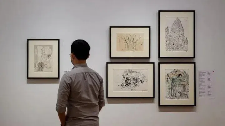 Wu’s sketch of An Indian Temple In Singapore, 1990 can be seen on the left.Credit: National Gallery Singapore