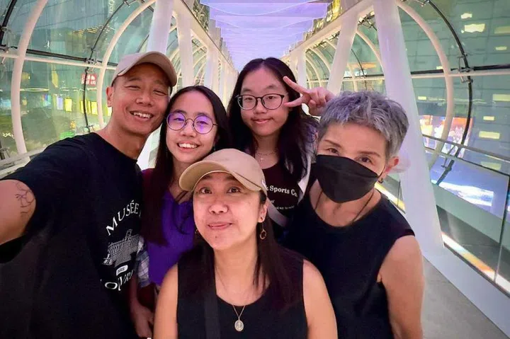 (Clockwise from top left) Mr Isaiah Kuan with his daughters Jayne and Joey, mother Grace Lye and wife Klessis Lee, at Orchard Gateway. Photo: Isaiah Kuan