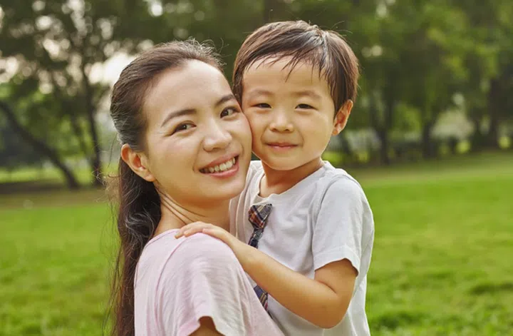 Asian family mom and boy in the park