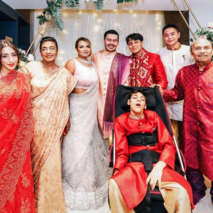 Jake at 16 years old, with his family. Judith's (third from left) greatest dream is for her child to lead as normal a life as possible.  