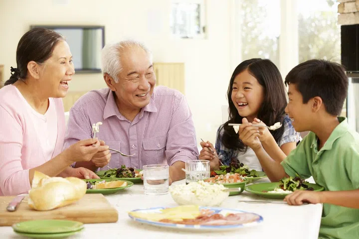42109016 - asian family sharing meal at home