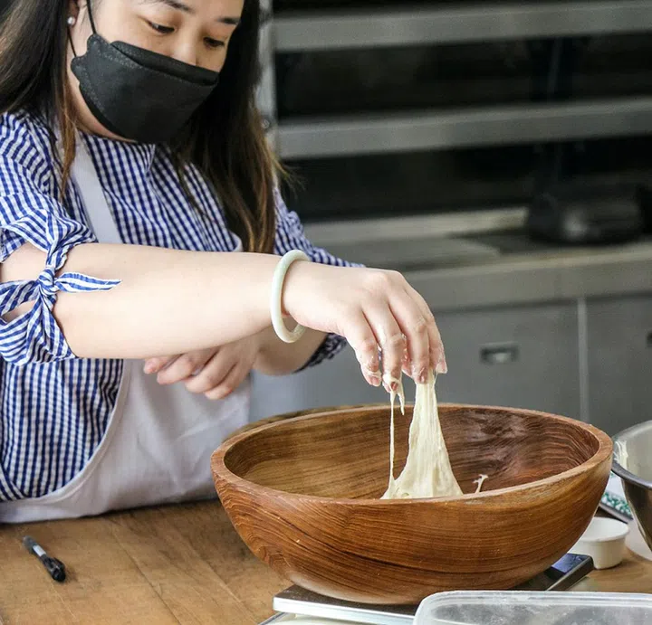 01. First, mix the active sourdough starter, water, salt, and flour in a bowl using the “Rubaud” method (i.e. using your hand as a scoop) until you get a nice and smooth dough.