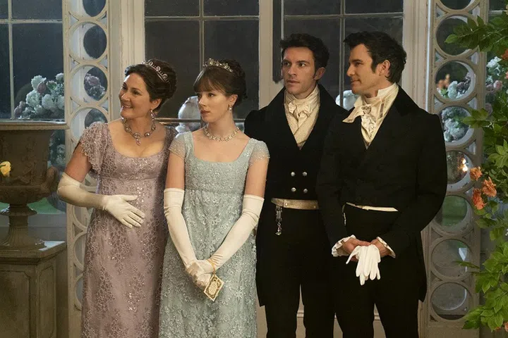 Bridgerton. (L to R) Ruth Gemmell as Lady Violet Bridgerton, Claudia Jessie as Eloise Bridgerton, Jonathan Bailey as Anthony Bridgerton, and Luke Thomspon as Benedict Bridgerton in episode 201 of Bridgerton. Cr. Liam Daniel/Netflix © 2021