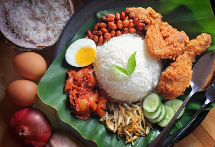 Nasi lemak is a dish that comprises rice made fragrant with coconut cream and pandan leaves.